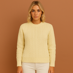 Women’s knitted sweater in apricot with classic cable design, soft and comfortable for casual and elegant winter outfits.
