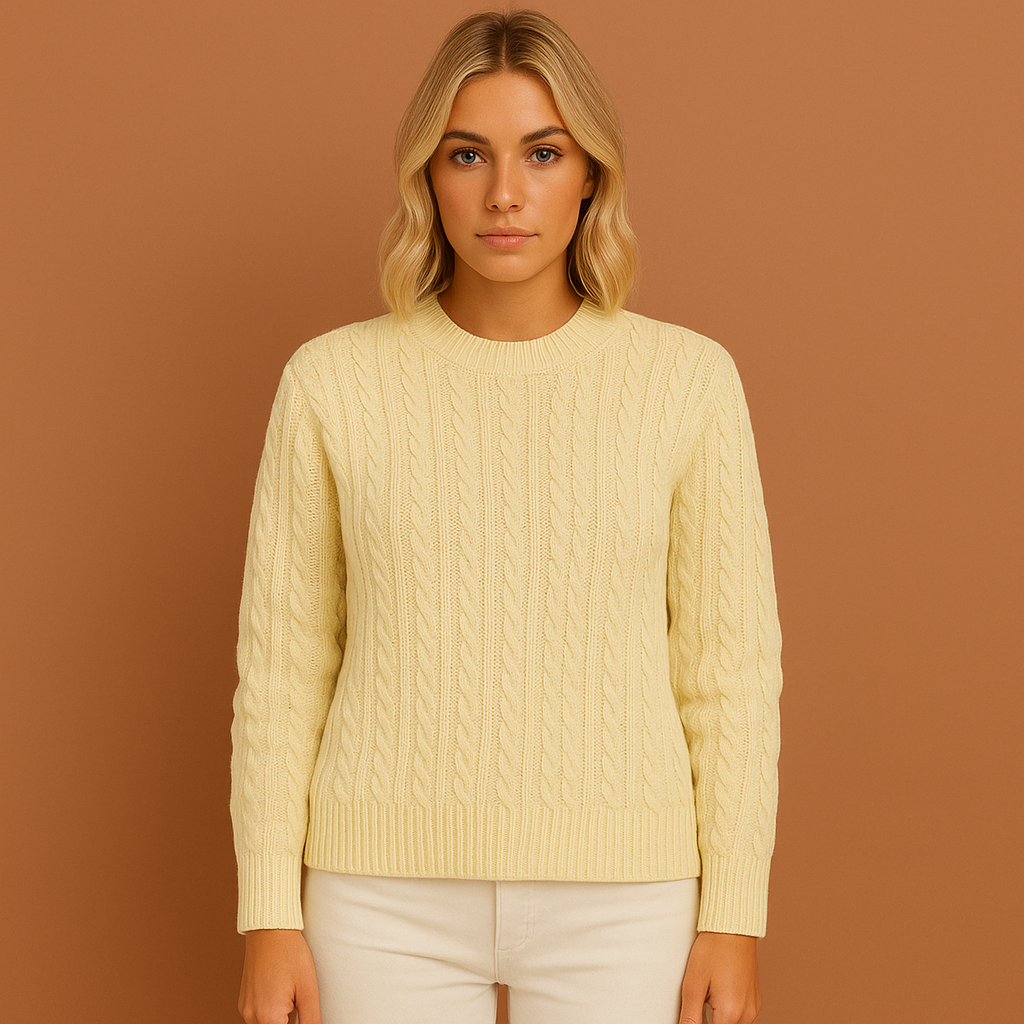 Women’s knitted sweater in apricot with classic cable design, soft and comfortable for casual and elegant winter outfits.