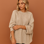 Women’s oversized knitted sweater in beige with casual winter style, soft and comfortable for cozy and stylish outfits.