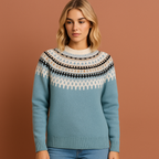 Women’s knitted sweater in blue with Scandinavian winter pattern, soft and comfortable for casual and stylish cold-weather outfits.