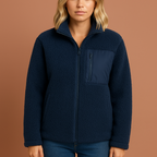 Women’s teddy zip jacket in blue with cozy fit and high collar, perfect for stylish cold-weather outfits.