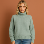 Women’s turtleneck sweater in blue with minimalist design, soft and comfortable for casual and stylish outfits.
