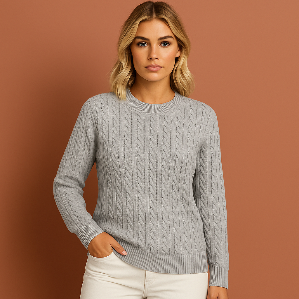 Women’s knitted sweater in gray with classic cable design, soft and comfortable for casual and elegant winter outfits.