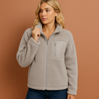 Women’s teddy zip jacket in gray with cozy fit and high collar, perfect for stylish cold-weather outfits.