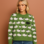 Women’s knitted sweater in green with playful sheep pattern, soft and cozy for casual and stylish winter outfits.