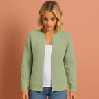 Women’s knitted cardigan in green with round neckline, soft and comfortable for casual and stylish outfits.