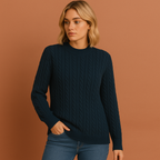 Women’s knitted sweater in navy blue with classic cable design, soft and comfortable for casual and elegant winter outfits.