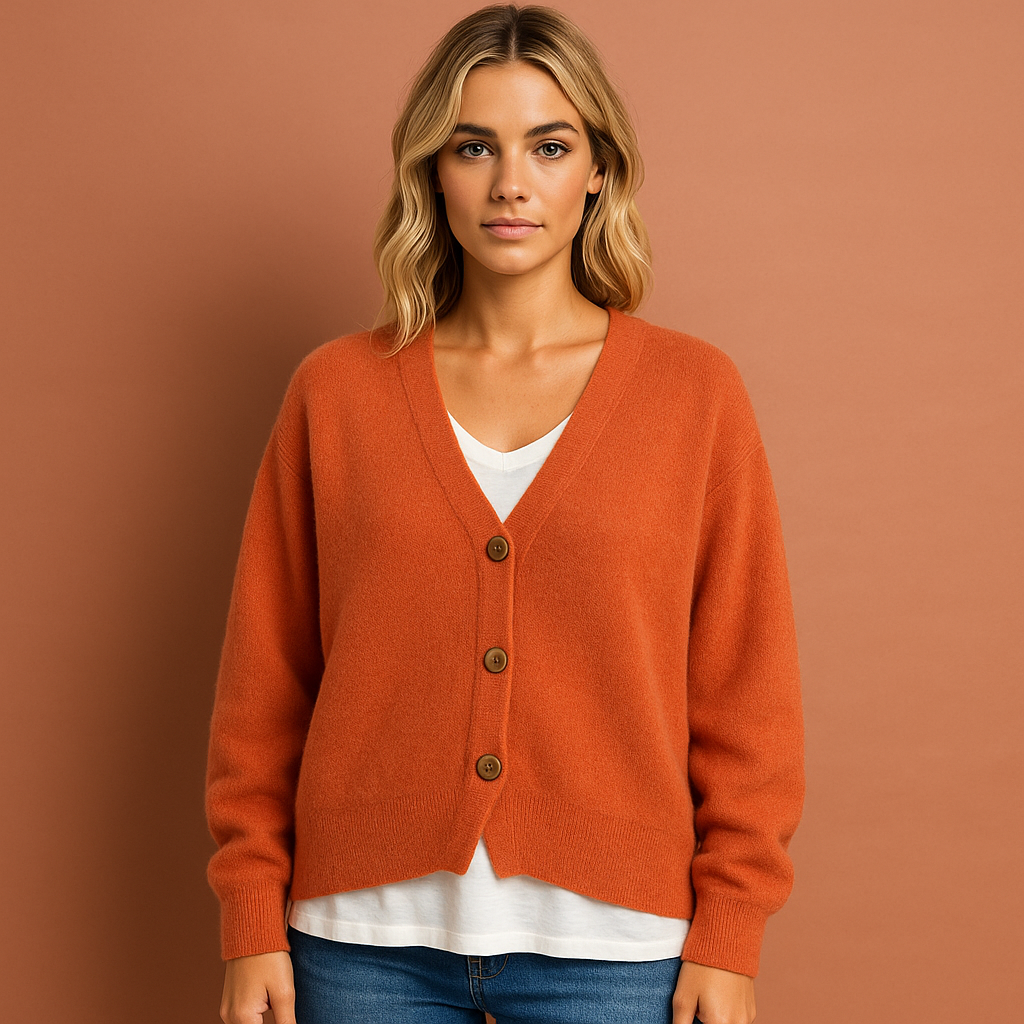Women’s knitted cardigan in orange with V-neck and button design, soft and comfortable for casual and elegant outfits.
