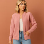 Women’s knitted cardigan in pink with round neckline, soft and comfortable for casual and stylish outfits.