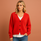 Women’s knitted cardigan in red with V-neck and button design, soft and comfortable for casual and elegant outfits.